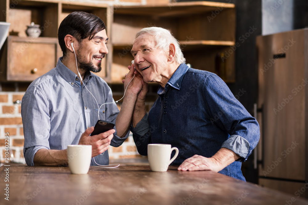 Aged smiling man talking on phone Aged smiling man talking on phone