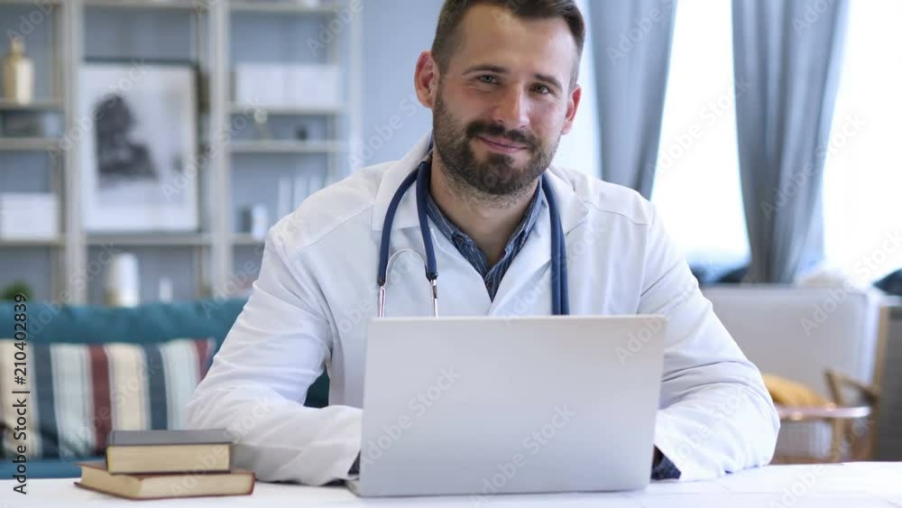 Thumbs Up by Positive Doctor Looking at Camera Thumbs Up by Positive Doctor Looking at Camera