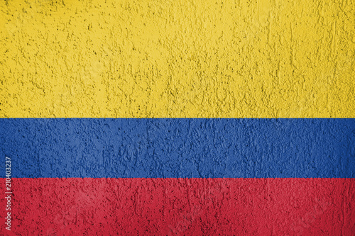 The texture of Colombia flag on the wall of the plaster.