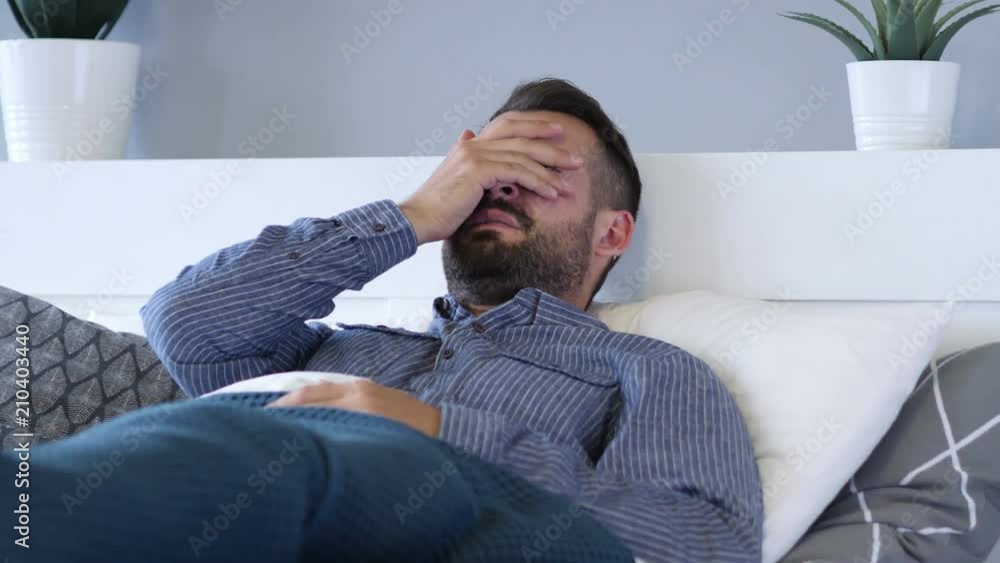Crying Sad Beard Man Lying in Bed Crying Sad Beard Man Lying in Bed