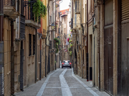 Car in a narrow cobblestone alley - Viana  Navarre  Spain