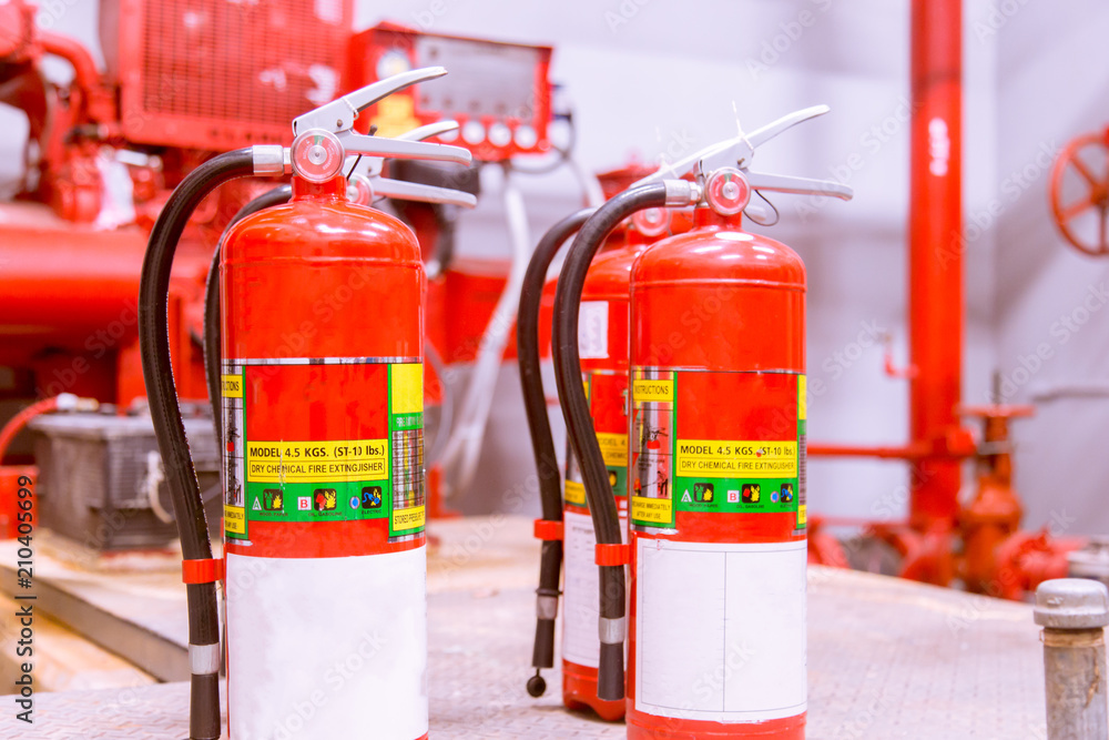 Red tank of fire extinguisher Overview of a powerful industrial fire extinguishing system.