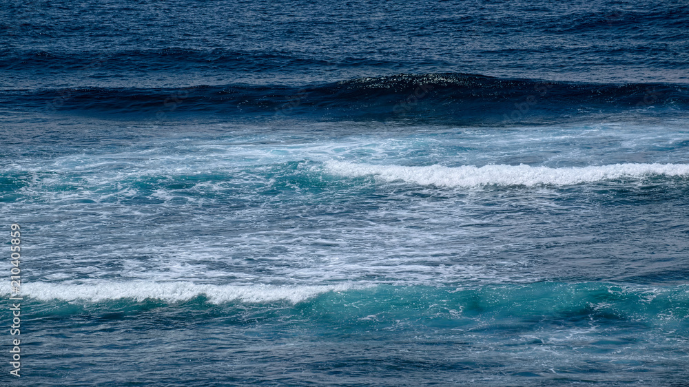 Fototapeta premium Natural background with blue tints of oceanic waves