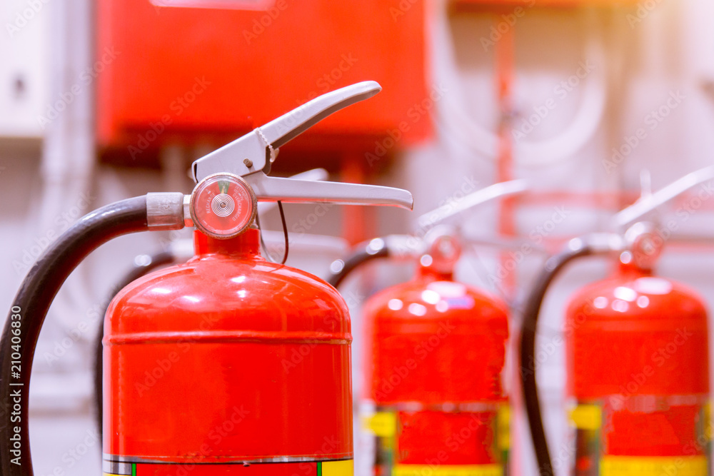 Red tank of fire extinguisher Overview of a powerful industrial fire extinguishing system. Red tank of fire extinguisher Overview of a powerful industrial fire extinguishing system.