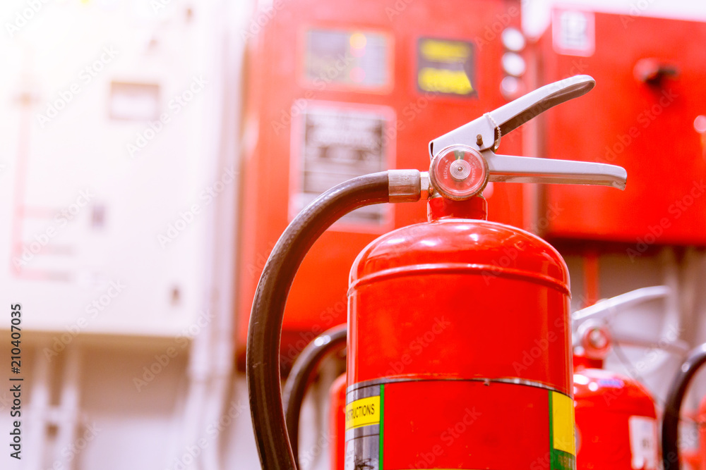 Red tank of fire extinguisher Overview of a powerful industrial fire extinguishing system. Red tank of fire extinguisher Overview of a powerful industrial fire extinguishing system.
