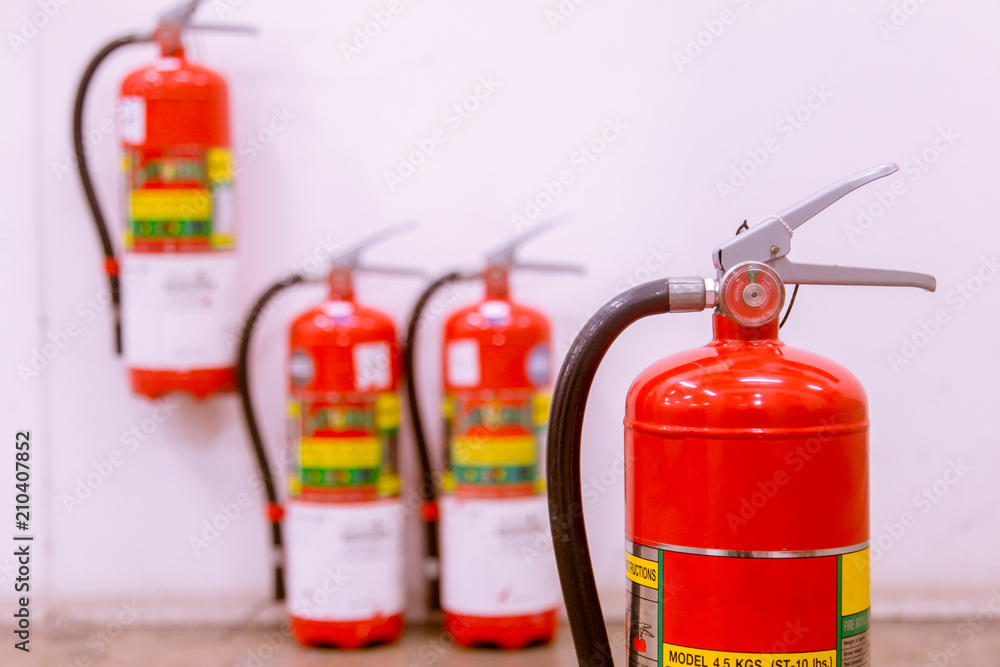 Red tank of fire extinguisher Overview of a powerful industrial fire extinguishing system. Red tank of fire extinguisher Overview of a powerful industrial fire extinguishing system.