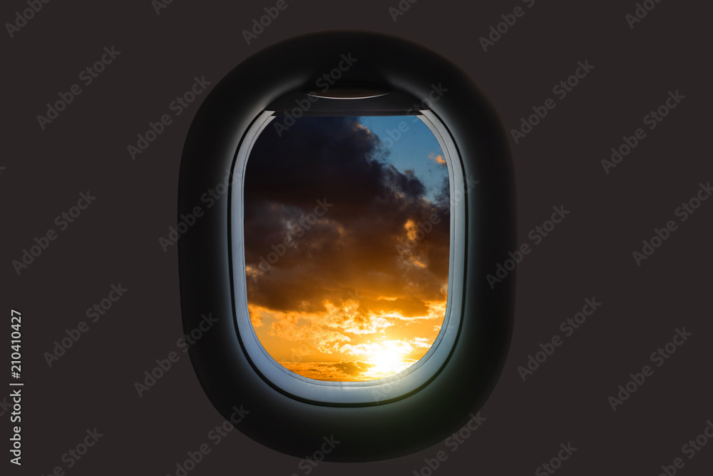 A girl is launching a paper airplane from a window at sunset. A girl is launching a paper airplane from a window at sunset.