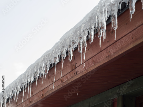 icicles on the roof of the cottage