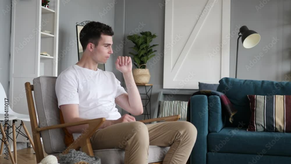 Sick Man Sitting on Couch and Coughing, Cough Gesture Sick Man Sitting on Couch and Coughing, Cough Gesture