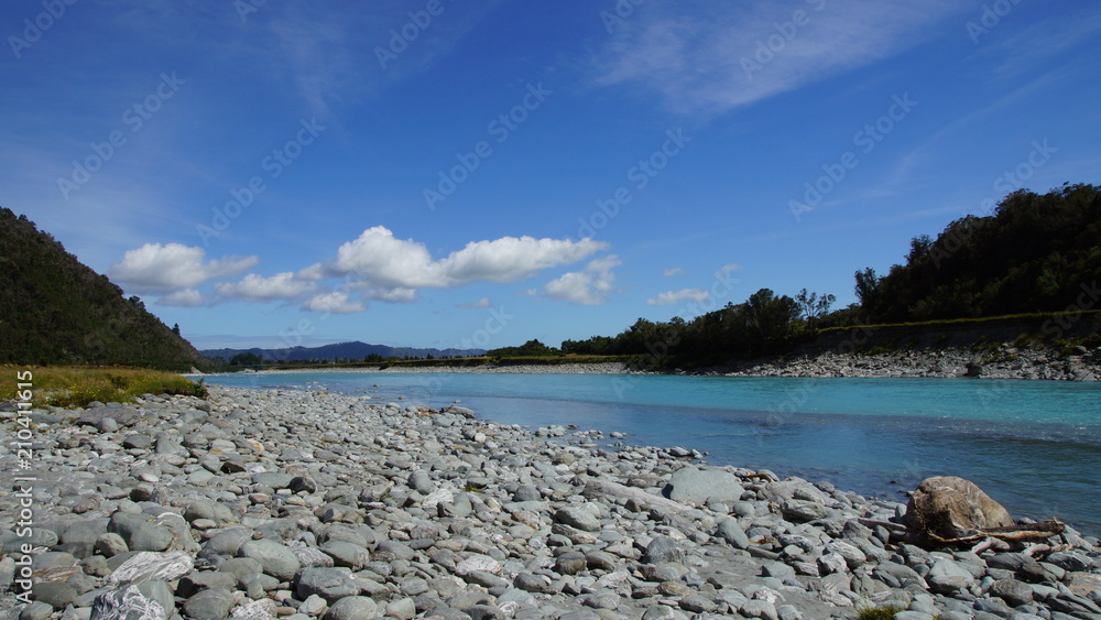 sunny afternoon at river at St. Joseph glacier, New Zealand