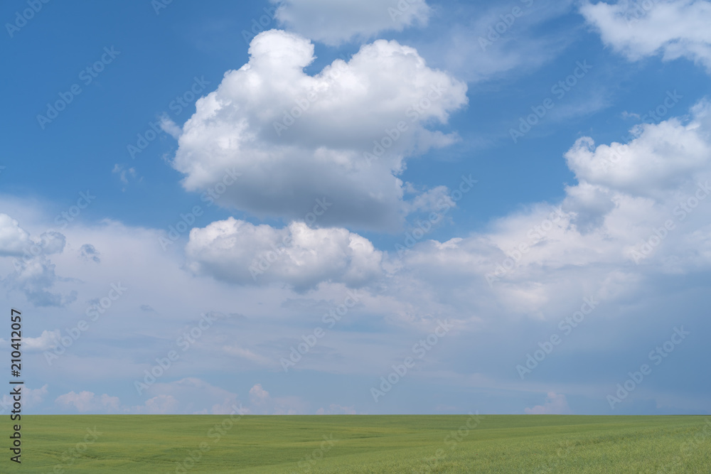 Podolia region, Ukraine. Landscape with dramatic clouds over agricultural field Podolia region, Ukraine. Landscape with dramatic clouds over agricultural field