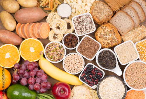 Carbohydrates food sources, top view on a table photo