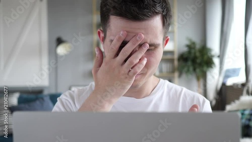 Close Up of Frustrated Man with Loss and Failure photo