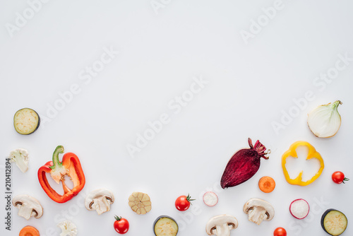slices of fresh healthy vegetables isolated on white background