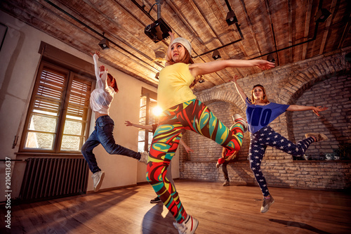 modern hip hop dancing girls in urban fitness center
