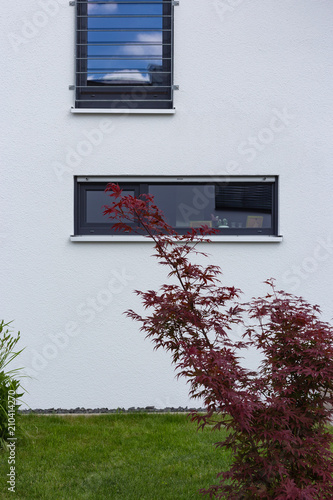 details facades of modern house architecture in rural countryside at springtime photo