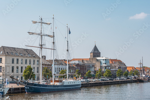 view of the city of kampen from the harbor with schooner netherlands holland