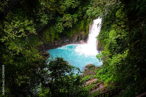 Jungle of Costa Rica waterfall. The river (rio celeste in tenorio national park close to Bijagua) has an emerald green color, caused by volcanic minerals
