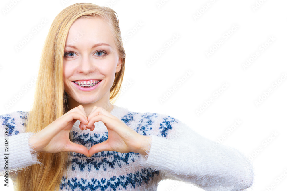 Teenage girl making heart sign with hands Teenage girl making heart sign with hands