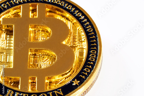 Gold metal coin bitcoin on white background close-up view from above. BTC. Bitcoin cryptocurrency. Anonymous. Virtual currency. Bright abstract background ideal for any design