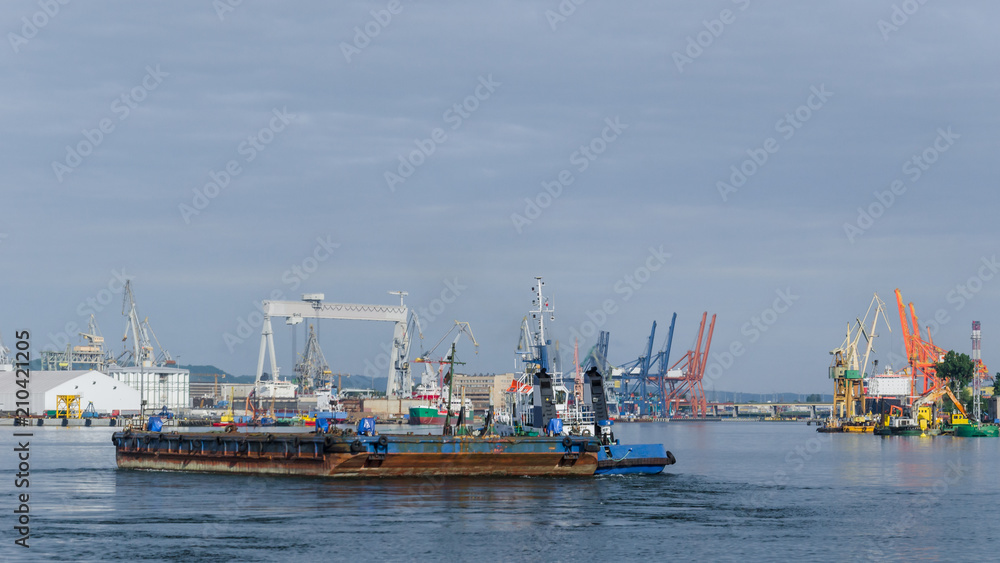 BARGE AND TUGBOAT - Morning traffic at the sea port in Gdynia
