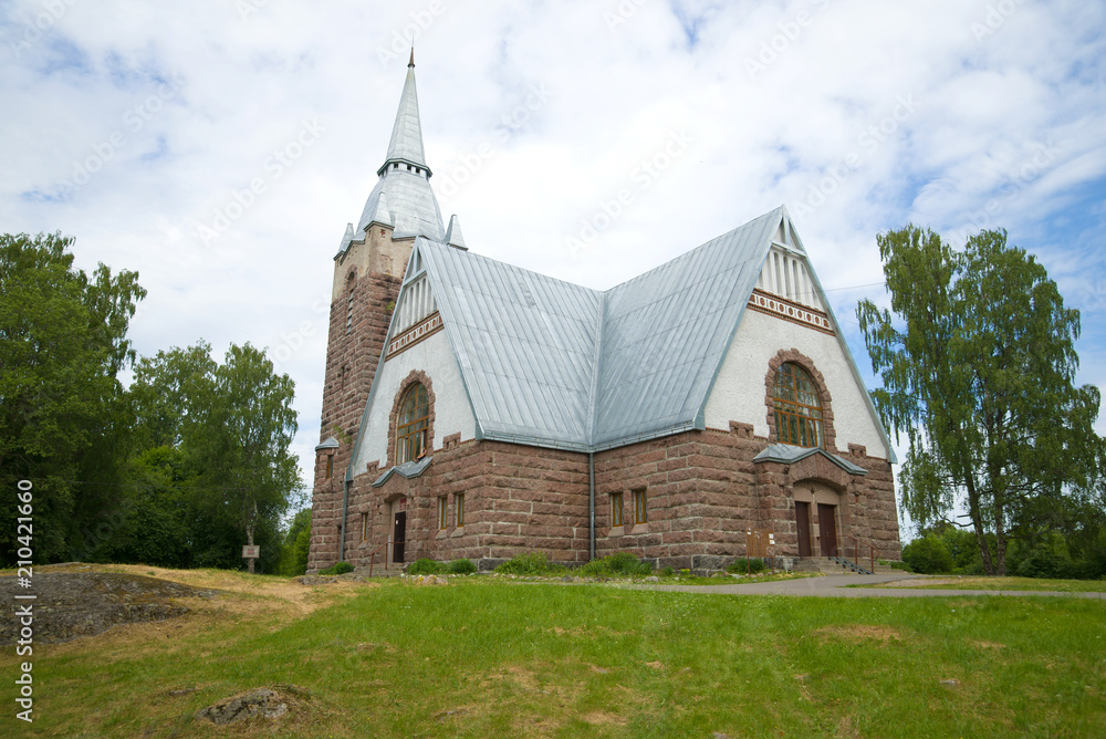 Old lutheran church in the June cloudy afternoon. Melnikovo, Leningrad Region. Russia Old lutheran church in the June cloudy afternoon. Melnikovo, Leningrad Region. Russia