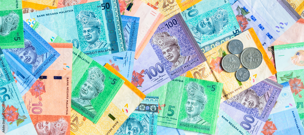 Malaysian ringgit banknotes and coins background. Financial concept. Malaysian ringgit banknotes and coins background. Financial concept.
