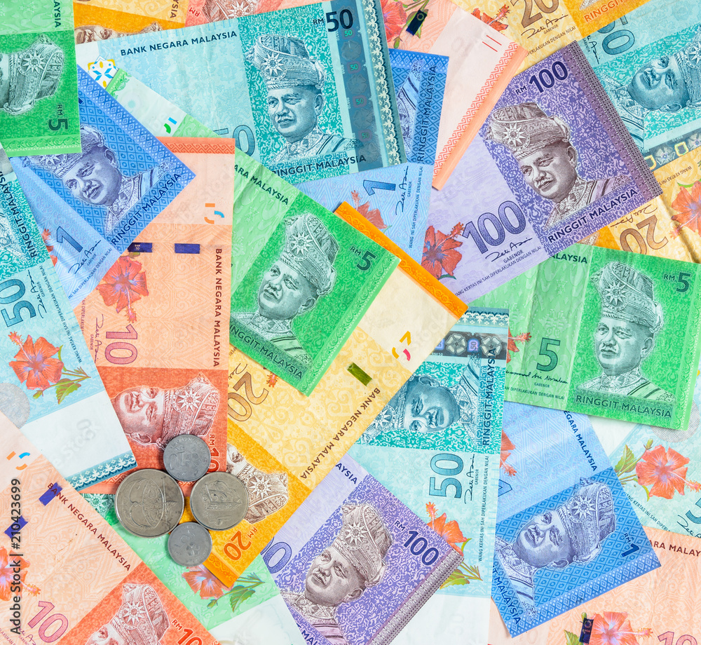 Malaysian ringgit banknotes and coins background. Financial concept. Malaysian ringgit banknotes and coins background. Financial concept.