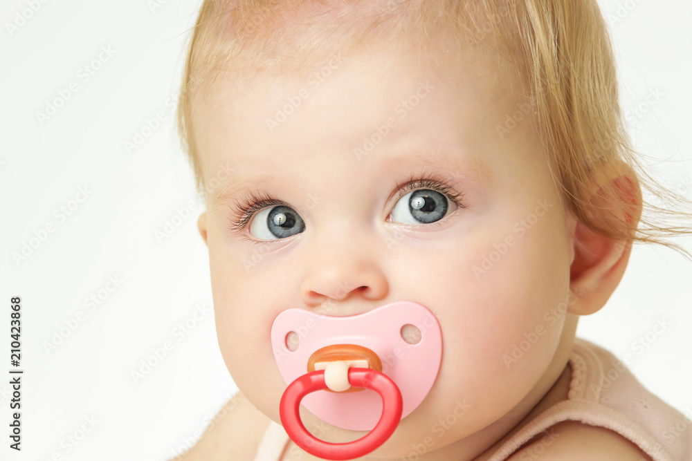 Studio portrait of adorable baby girl with pacifier
Studio portrait of adorable baby girl with pacifier