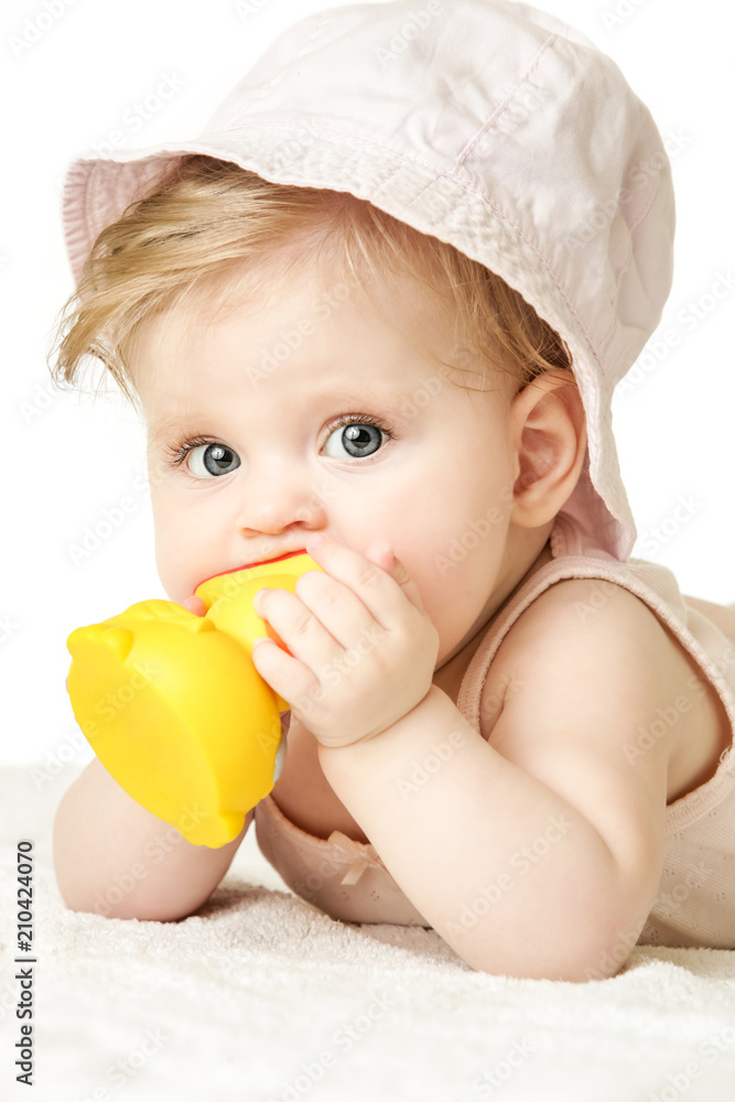 Studio portrait of adorable baby girl wearing pink hat and playing with yellow rubber duck, isolated on the white background, summer vacation concept
Studio portrait of adorable baby girl wearing pink hat and playing with yellow rubber duck, isolated on the white background, summer vacation concept
