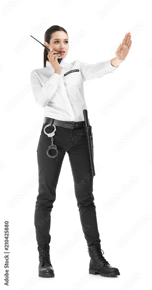 Female security guard using portable radio transmitter on white background Female security guard using portable radio transmitter on white background