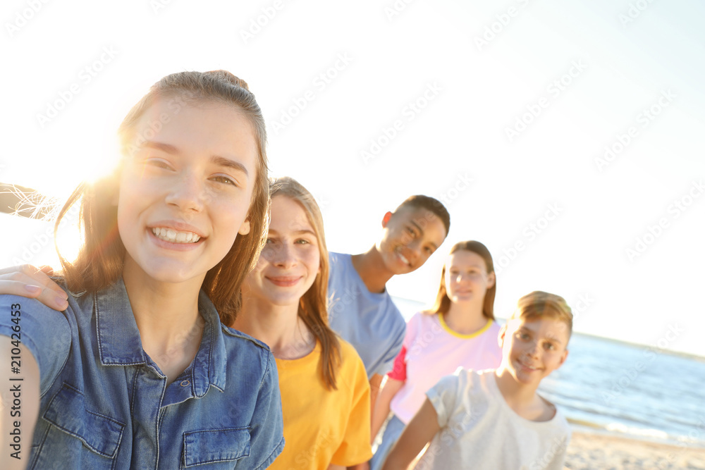 Group of children taking selfie on beach. Summer camp Group of children taking selfie on beach. Summer camp