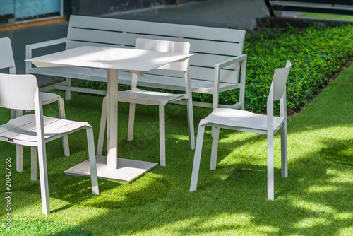 Group set of white table and chair on green grass exterior modern contemporary