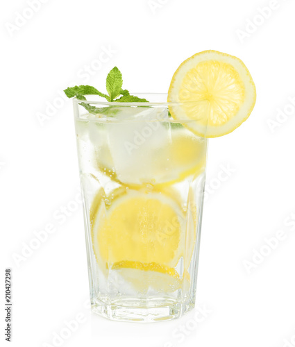 Glass of natural lemonade with mint on white background