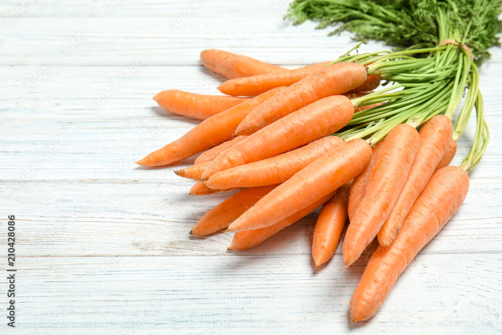 Ripe carrots on wooden background. Healthy diet Ripe carrots on wooden background. Healthy diet