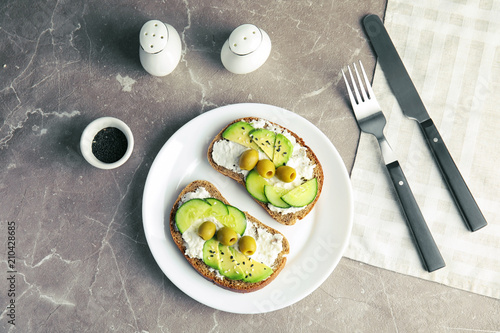 Tasty breakfast with crisp avocado  toasts on table, top view