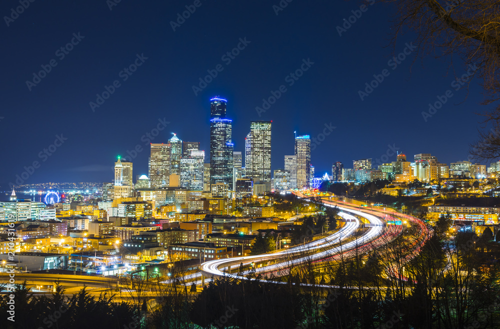 Seattle cityscape at night with traffic light on freeway,Washington,usa.