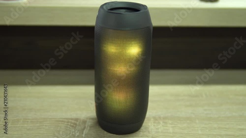 Portable speaker glows.