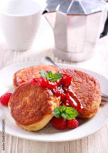 Quark cheese fritters with raspberry jam photo