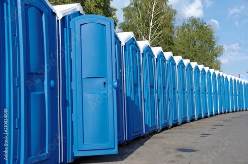A line of portable toilets. photo