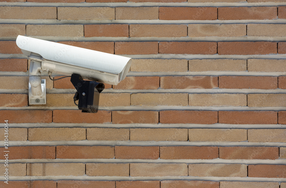 Surveillance camera brick wall
