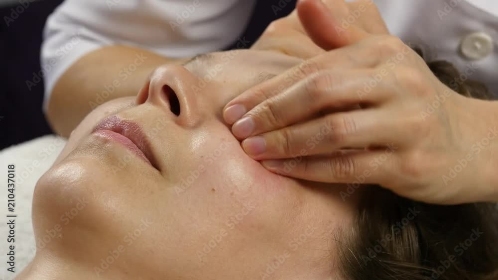plastic face massage in spa saton. woman enjoys the services of a professional massage therapist. 4K plastic face massage in spa saton. woman enjoys the services of a professional massage therapist. 4K