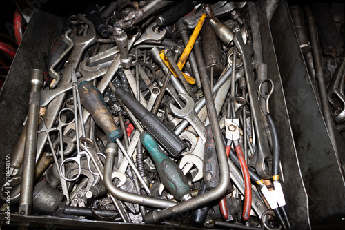 tools for car repair lie in an iron box