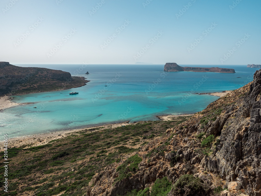 Fototapeta premium Beautiful Balos lagoon on Crete island, Greece. Tourists relax and bath in crystal clear water of Balos beach. June, 2018