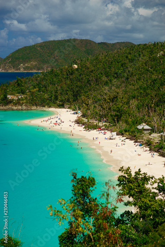 Beautiful beach with a lot of people and green hills foreground, St. John US Virgin Islands
