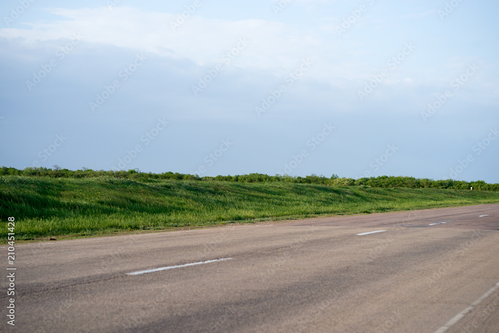 Fototapeta premium road in fields covered
