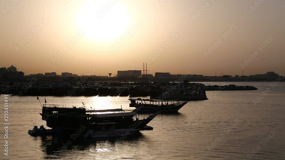 Panorama view of harbour at evening in old town of Doha - capital and most populous city in Qatar, Persian Gulf, Arabian Peninsula