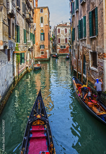 Gondolas in Venice canal, narrow street, Italy © Travel Faery