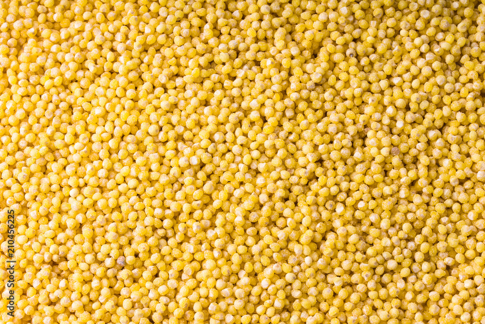 Closeup of yellow millet grains for background or texture. Closeup of yellow millet grains for background or texture.