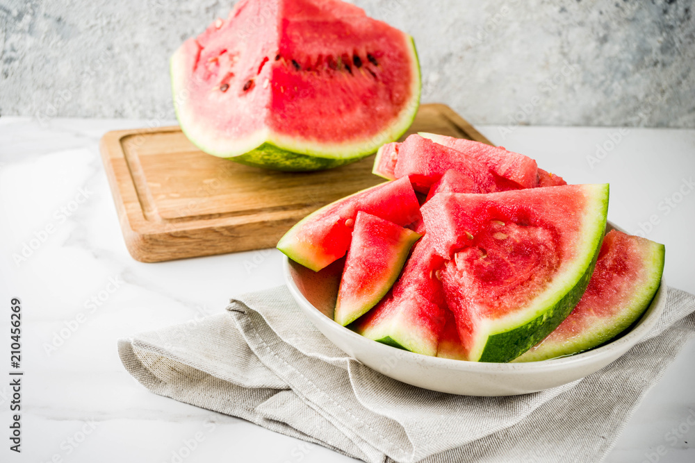 Fresh raw sliced watermelon on light concrete table copy space Fresh raw sliced watermelon on light concrete table copy space